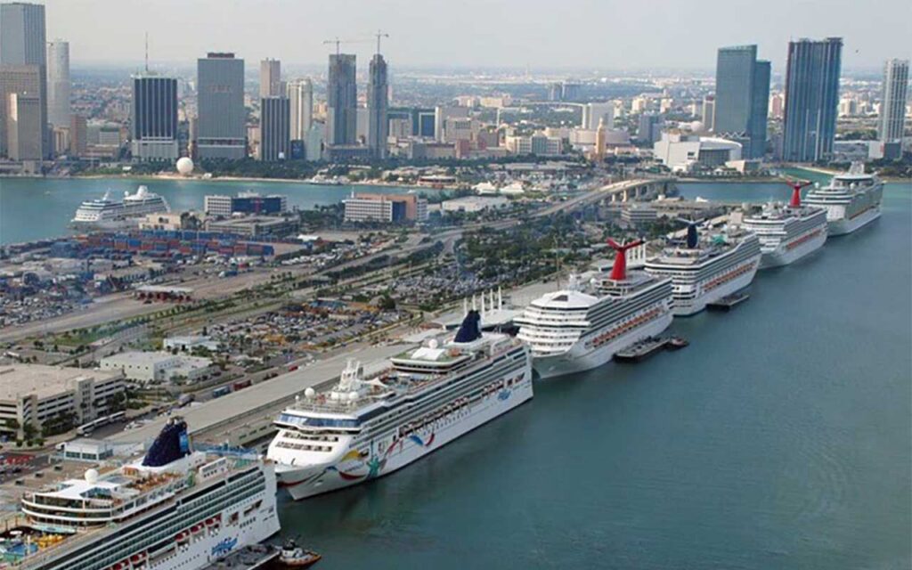 Aerial view of PortMiami terminals with multiple cruise ships docked