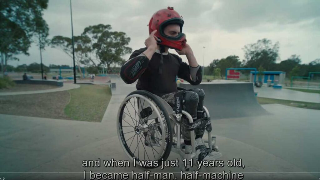 Person with disability accessing the beach using assistive equipment as part of an inclusion program in New South Wales
