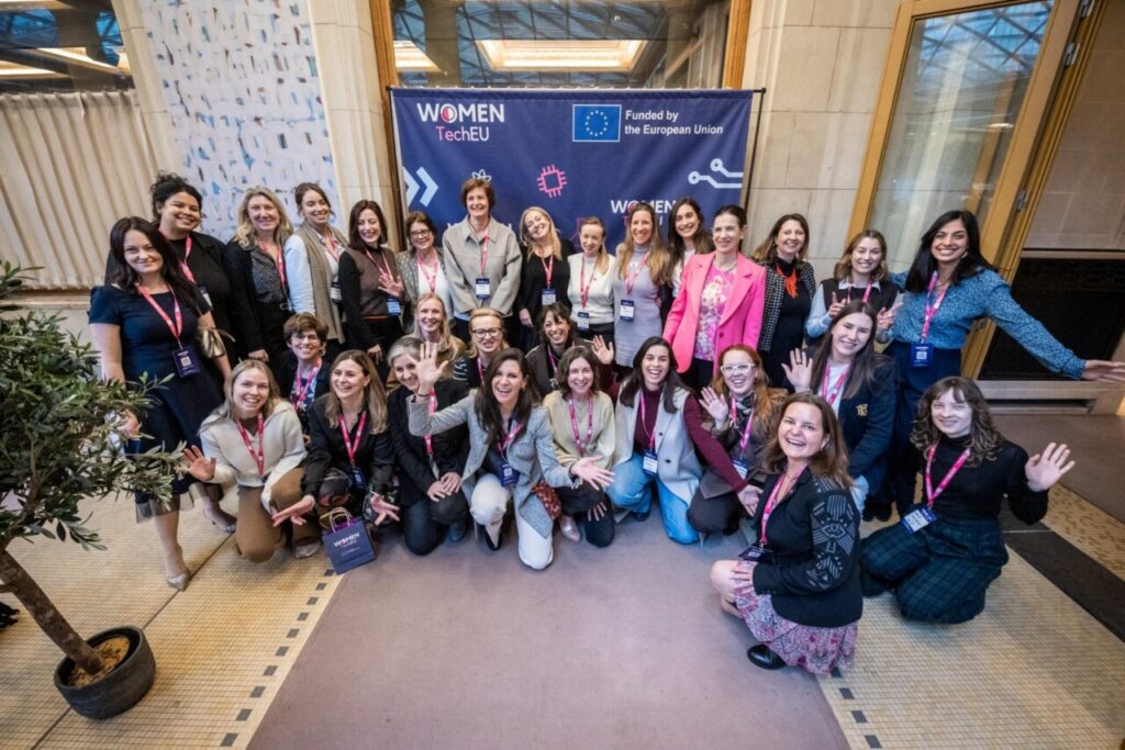 Participants gathered in front of a Women TechEU and European Union banner